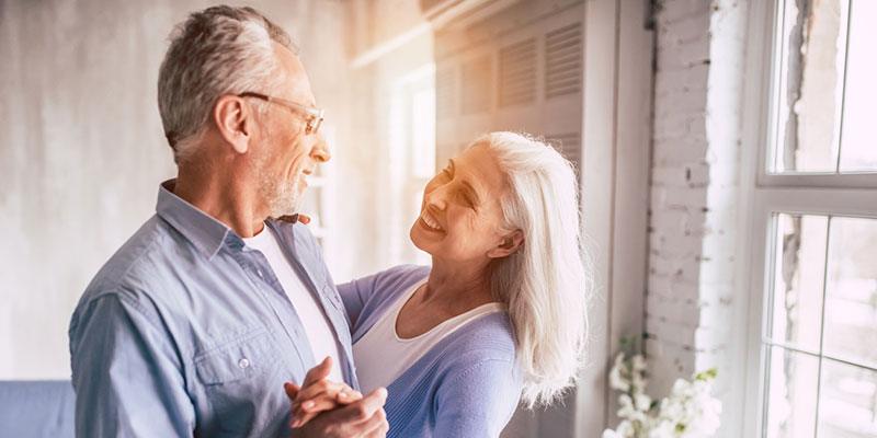 elderly couple enjoying independent living at The Delaney at South Shore